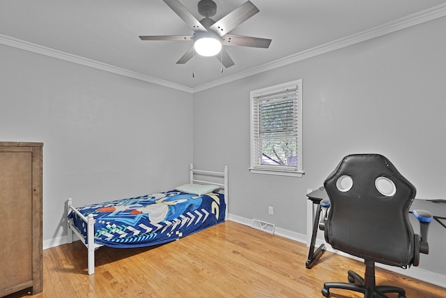 8475 Homerich Ave SW, Byron Center, MI 49315 - bedroom featuring ornamental molding, wood finished floors, ceiling fan, and a desk