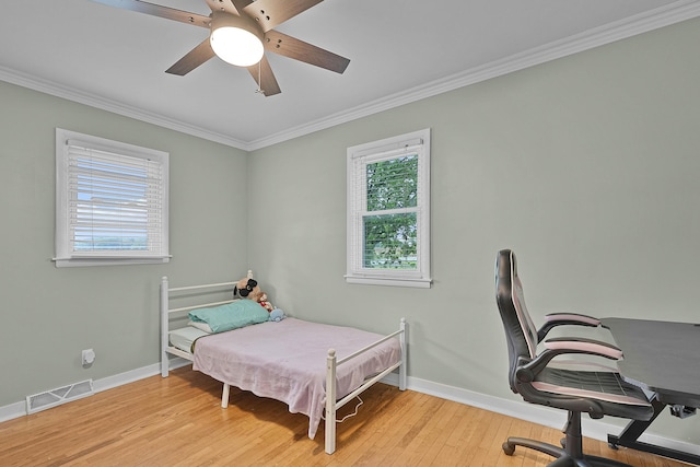 8475 Homerich Ave SW, Byron Center, MI 49315 - bedroom with multiple windows, crown molding, light wood-style floors, an office area, and a ceiling fan