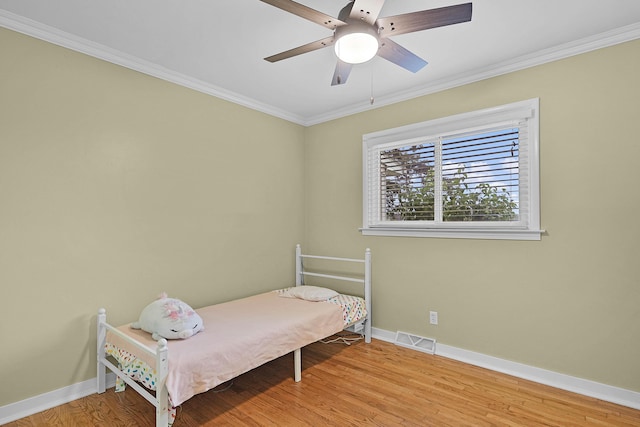 8475 Homerich Ave SW, Byron Center, MI 49315 - bedroom featuring light wood-style flooring, crown molding, and ceiling fan