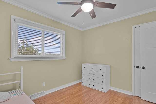 8475 Homerich Ave SW, Byron Center, MI 49315 - bedroom with wood finished floors, crown molding, and ceiling fan
