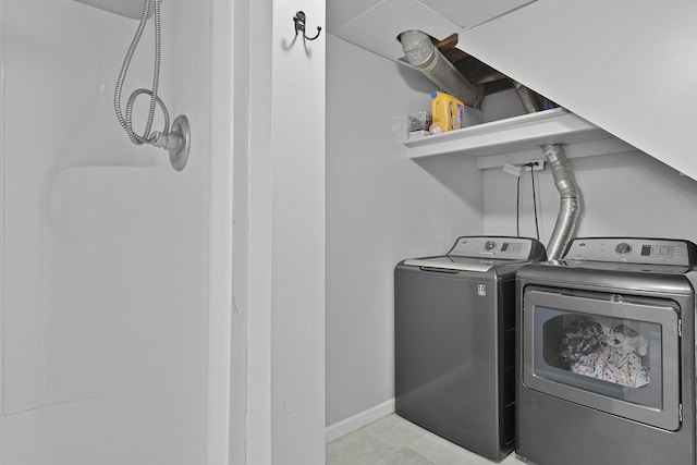 8475 Homerich Ave SW, Byron Center, MI 49315 - washroom featuring washing machine and dryer and baseboards