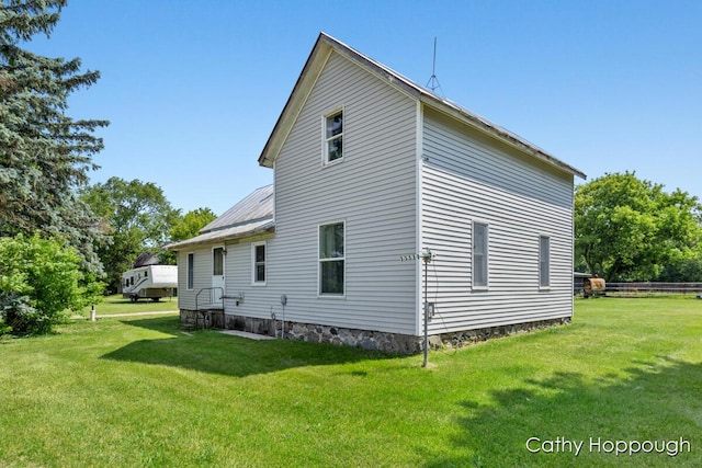 3119 S Hillman Rd, Sidney, MI 48885 - rear view of house with a lawn