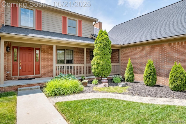 48671 Timber Crest Ct, Plymouth, MI 48170 - view of front of home featuring brick siding, covered porch, and roof with shingles