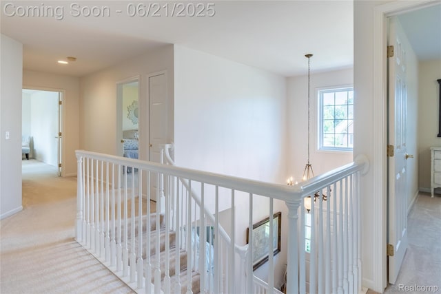 48671 Timber Crest Ct, Plymouth, MI 48170 - hallway with carpet flooring, an upstairs landing, a chandelier, and recessed lighting