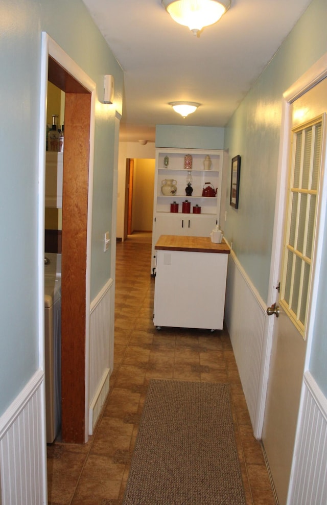 229 Riverside Dr, Hart, MI 49420 - hall with a wainscoted wall and washer / dryer