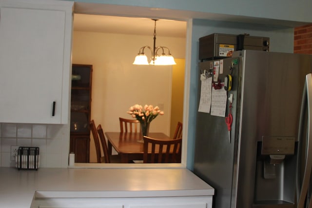 229 Riverside Dr, Hart, MI 49420 - dining room featuring a chandelier