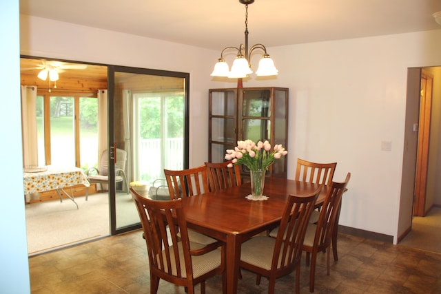 229 Riverside Dr, Hart, MI 49420 - dining room featuring ceiling fan and a chandelier