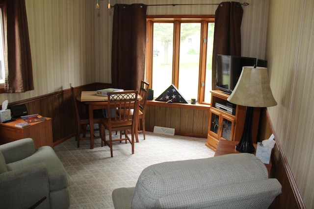 229 Riverside Dr, Hart, MI 49420 - living room featuring wallpapered walls and wainscoting