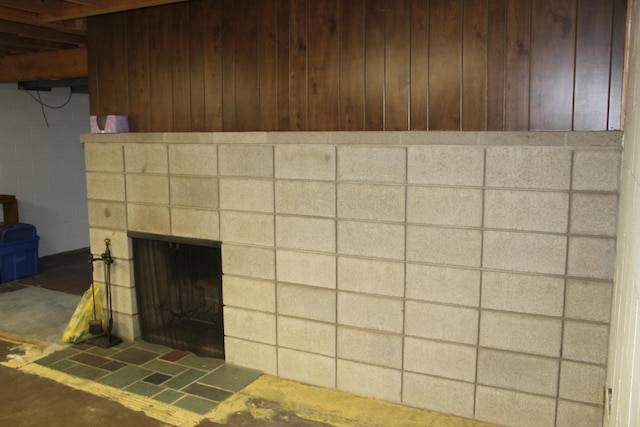 229 Riverside Dr, Hart, MI 49420 - detailed view of a fireplace, concrete block wall, and wood walls