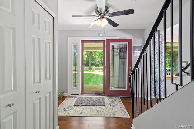 20551 Elwell Rd, Belleville, MI 48111 - entryway with wood finished floors, stairs, and a ceiling fan