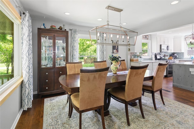 20551 Elwell Rd, Belleville, MI 48111 - dining space featuring dark wood-style floors, a chandelier, and recessed lighting