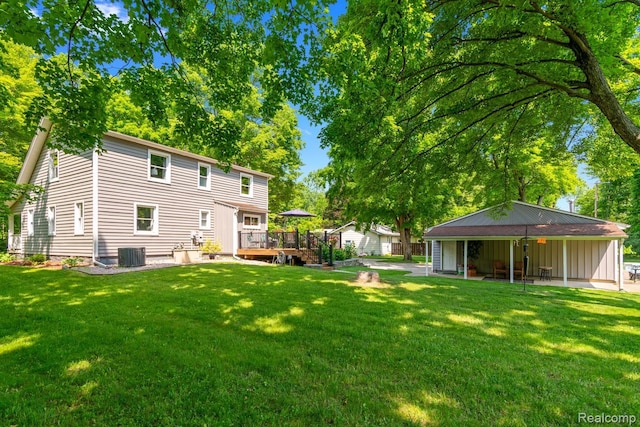 20551 Elwell Rd, Belleville, MI 48111 - view of green lawn with a deck