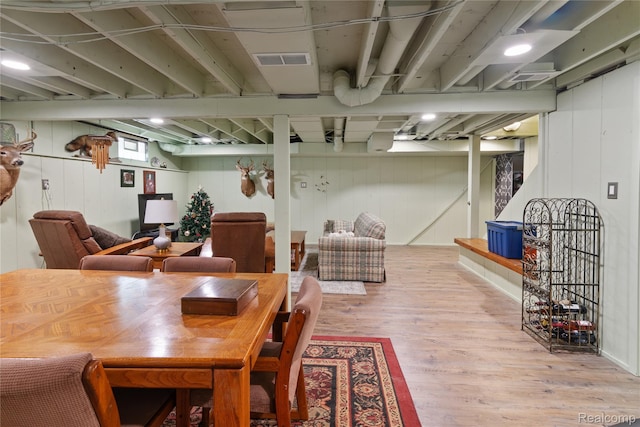 20551 Elwell Rd, Belleville, MI 48111 - dining space featuring wood finished floors and wood walls