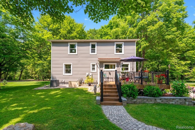 20551 Elwell Rd, Belleville, MI 48111 - back of house featuring a deck and a yard