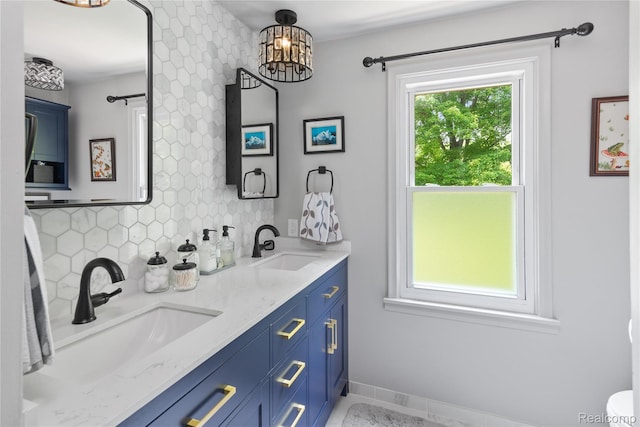 20551 Elwell Rd, Belleville, MI 48111 - full bath with decorative backsplash, double vanity, and a chandelier