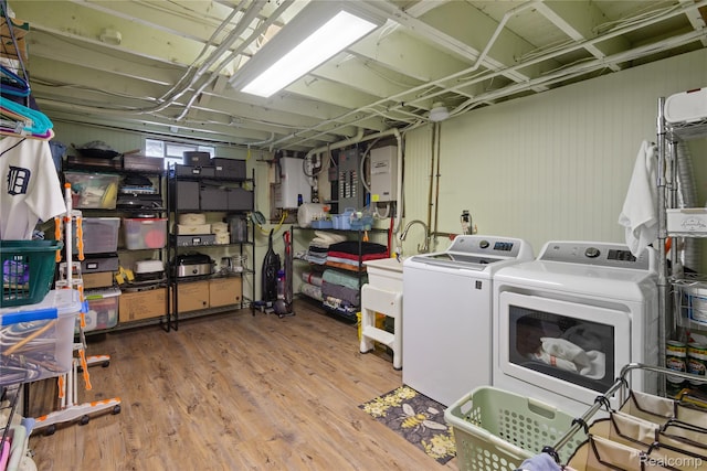 20551 Elwell Rd, Belleville, MI 48111 - laundry area with washing machine and dryer and wood finished floors