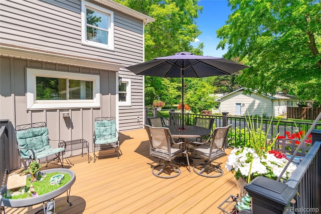 20551 Elwell Rd, Belleville, MI 48111 - wooden terrace with outdoor dining space