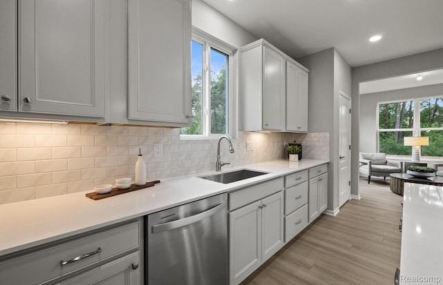 3045 Sheffield Cir, Clarkston, MI 48346 - kitchen featuring dishwasher, plenty of natural light, light wood finished floors, light countertops, and recessed lighting