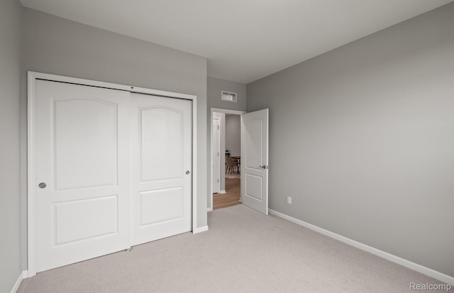 3045 Sheffield Cir, Clarkston, MI 48346 - unfurnished bedroom with light colored carpet and a closet