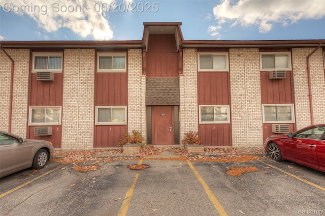 7615 Woodview St # 3, Westland, MI 48185 - view of property featuring uncovered parking and a wall unit AC