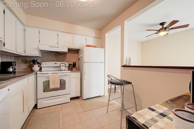 7615 Woodview St # 3, Westland, MI 48185 - kitchen with white appliances, under cabinet range hood, tasteful backsplash, white cabinets, and a ceiling fan