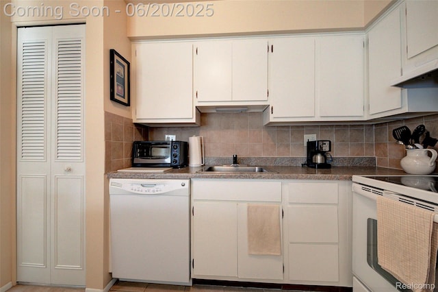 7615 Woodview St # 3, Westland, MI 48185 - kitchen with white appliances, decorative backsplash, white cabinetry, and under cabinet range hood