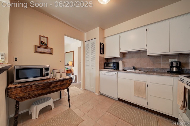 7615 Woodview St # 3, Westland, MI 48185 - kitchen featuring white appliances, decorative backsplash, white cabinetry, and light tile patterned floors