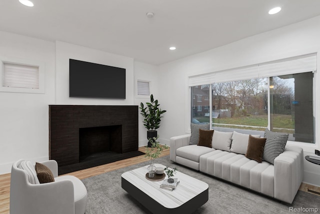 3297 Taylor St, Detroit, MI 48206 - living area with wood finished floors, recessed lighting, and a brick fireplace