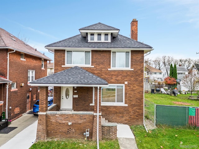 3297 Taylor St, Detroit, MI 48206 - view of front facade featuring a chimney, brick siding, and a high end roof