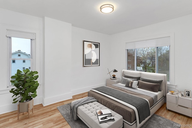 3297 Taylor St, Detroit, MI 48206 - bedroom with light wood-style flooring and baseboards