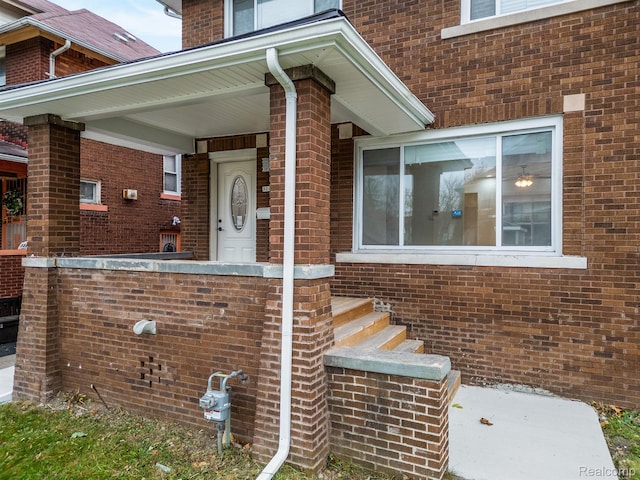 3297 Taylor St, Detroit, MI 48206 - doorway to property featuring brick siding
