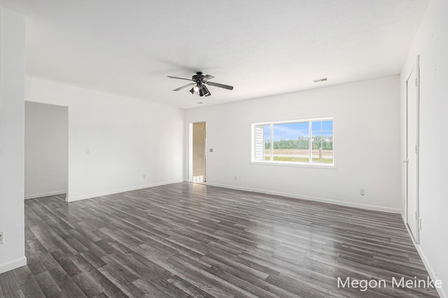 3682 W Long Lake Rd, Orleans, MI 48865 - spare room featuring ceiling fan and dark wood-type flooring