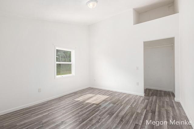 3682 W Long Lake Rd, Orleans, MI 48865 - unfurnished bedroom with wood finished floors