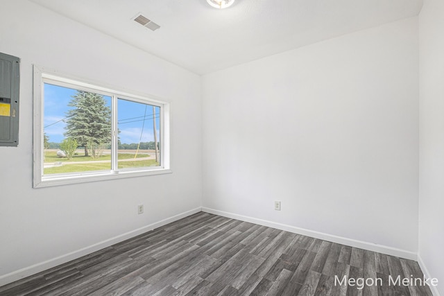 3682 W Long Lake Rd, Orleans, MI 48865 - unfurnished room with dark wood finished floors and electric panel