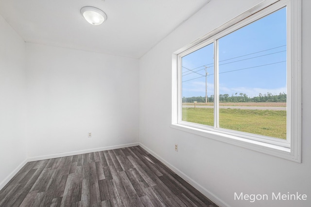 3682 W Long Lake Rd, Orleans, MI 48865 - unfurnished room with dark wood finished floors and baseboards