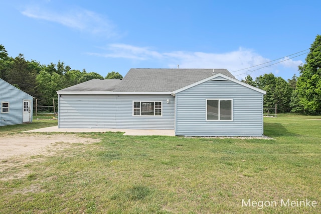 3682 W Long Lake Rd, Orleans, MI 48865 - rear view of house with a lawn and a shingled roof