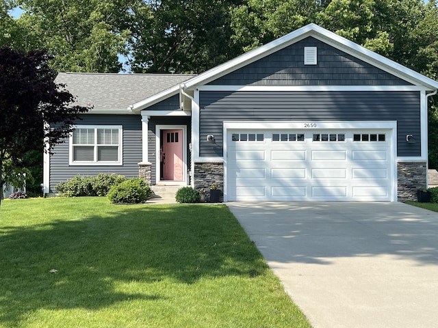 2650 Eagle Rdg, Muskegon, MI 49444 - view of front of property featuring a garage, driveway, a front yard, stone siding, and roof with shingles