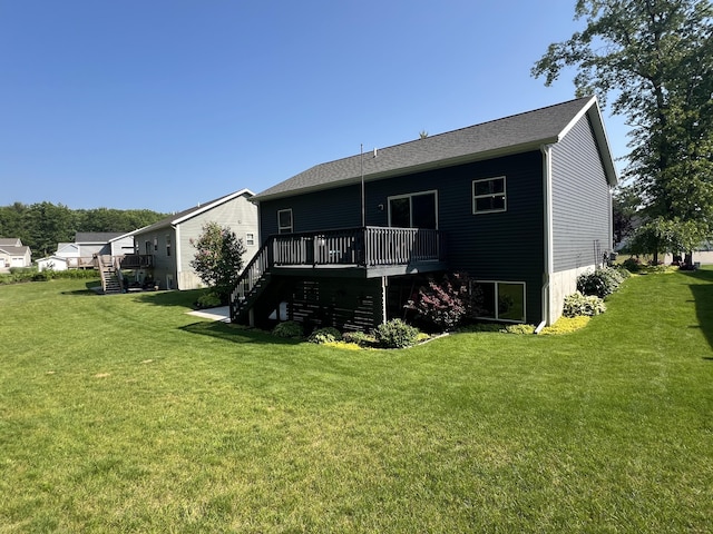 2650 Eagle Rdg, Muskegon, MI 49444 - rear view of property with stairway, a deck, and a lawn