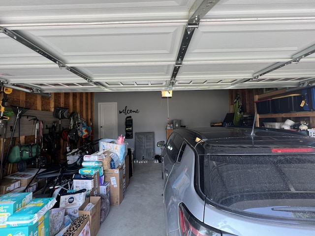 2650 Eagle Rdg, Muskegon, MI 49444 - garage featuring a garage door opener