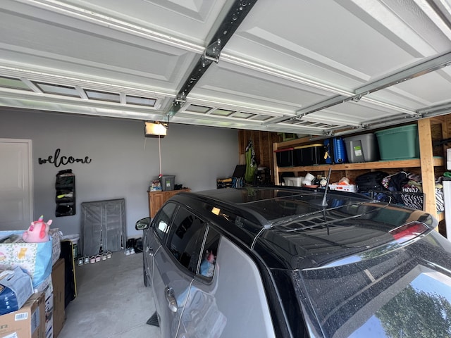 2650 Eagle Rdg, Muskegon, MI 49444 - garage featuring a garage door opener