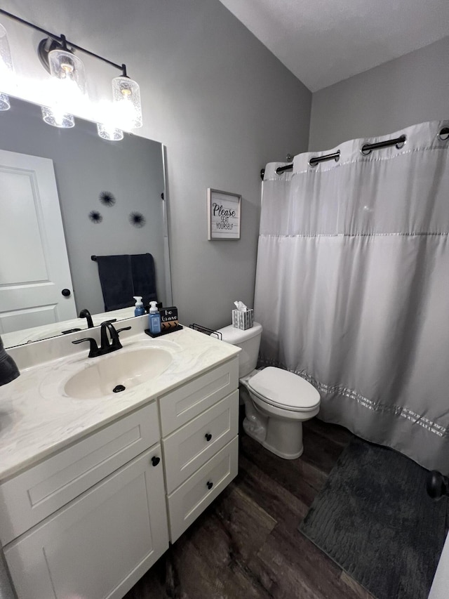 2650 Eagle Rdg, Muskegon, MI 49444 - full bath featuring wood finished floors, vanity, and a shower with curtain