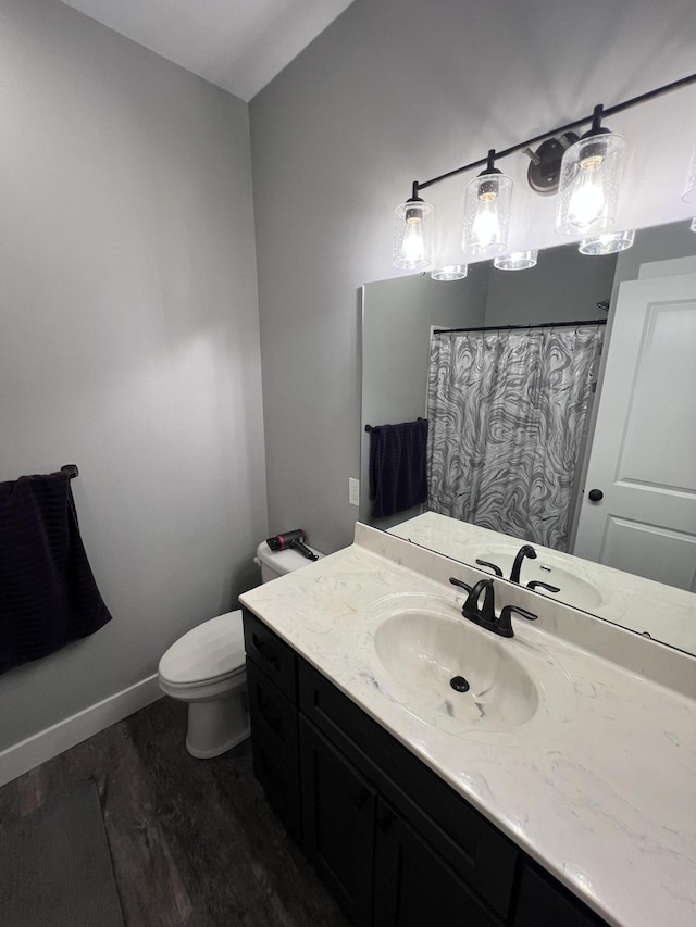 2650 Eagle Rdg, Muskegon, MI 49444 - bathroom featuring wood finished floors, vanity, and a shower with shower curtain