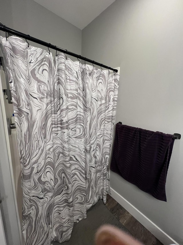 2650 Eagle Rdg, Muskegon, MI 49444 - bathroom with wood finished floors and shower / tub combo