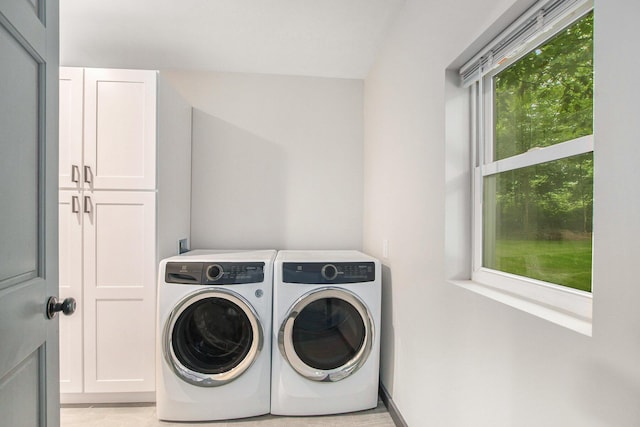 6490 Island Lake Rd, Holland, MI 49423 - laundry room with cabinet space and washing machine and dryer