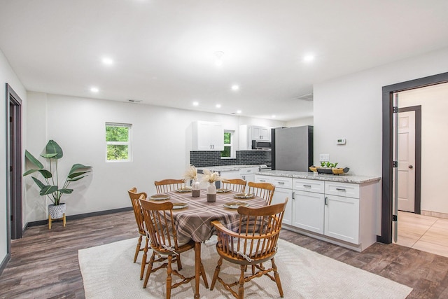 6490 Island Lake Rd, Holland, MI 49423 - dining area with recessed lighting and wood finished floors