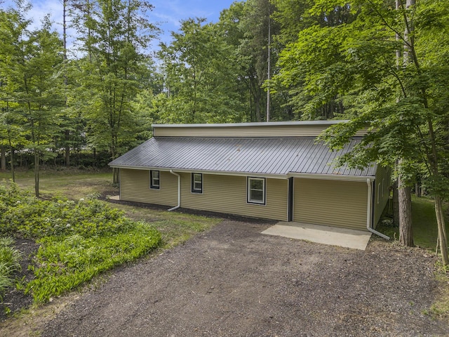 6490 Island Lake Rd, Holland, MI 49423 - view of front facade with a metal roof