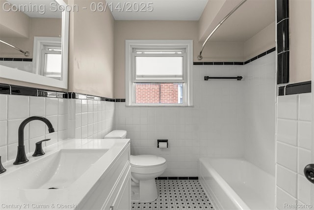 30345 Rush St, Garden City, MI 48135 - full bath featuring tile walls, vanity, washtub / shower combination, and wainscoting