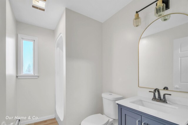 7698 E Holland Rd, Saginaw, MI 48601 - bathroom with vanity and toilet