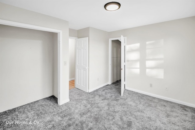 7698 E Holland Rd, Saginaw, MI 48601 - unfurnished bedroom with carpet floors and baseboards