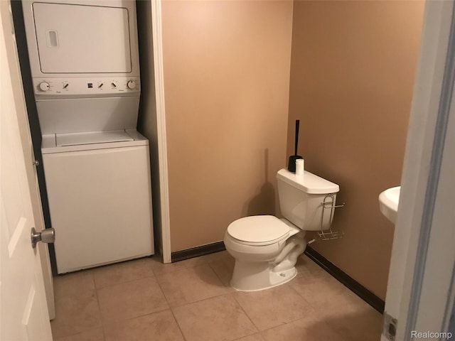 13635 Osborn Ave Unit 126, Dearborn, MI 48126 - bathroom featuring stacked washing machine and dryer and tile patterned flooring